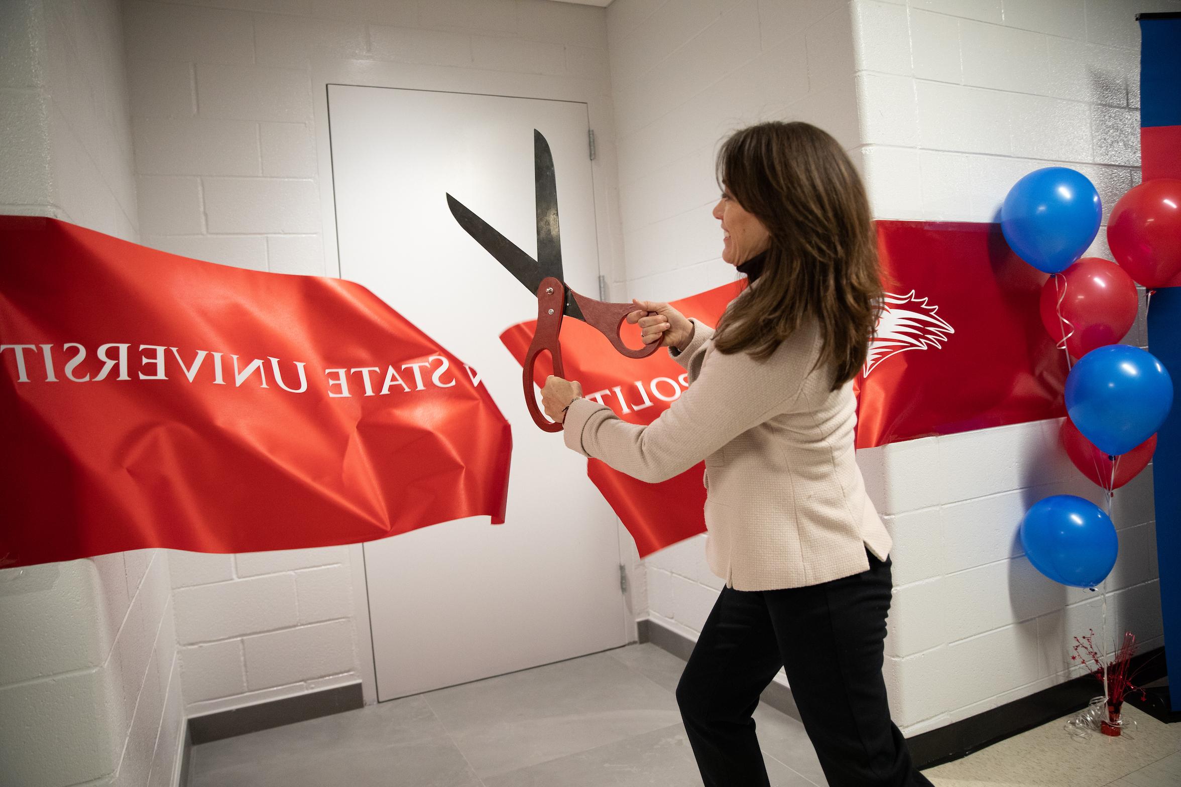 Dr. Davidson cutting the ribbon